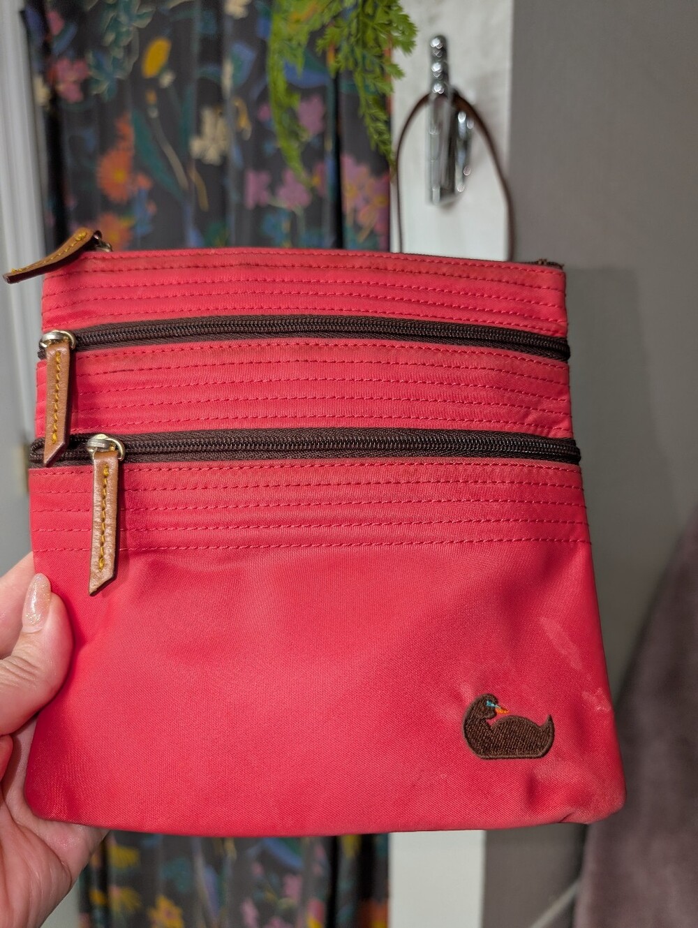 Hot pink Dooney & Bourke Nylon Triple Zip crossbody bag